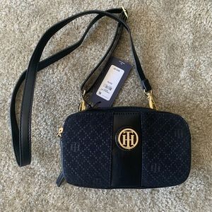 Small cross body bag by Tommy Hilfiger in black.